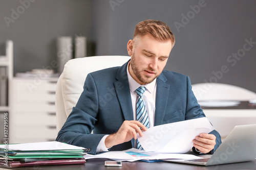 Male accountant working in ...