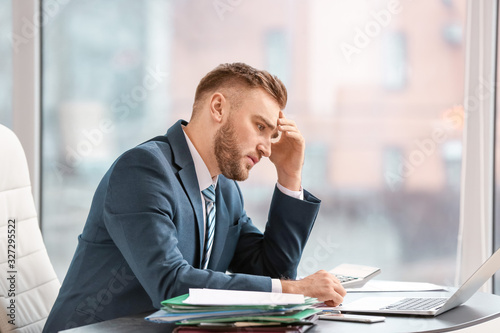 Male accountant working in ...