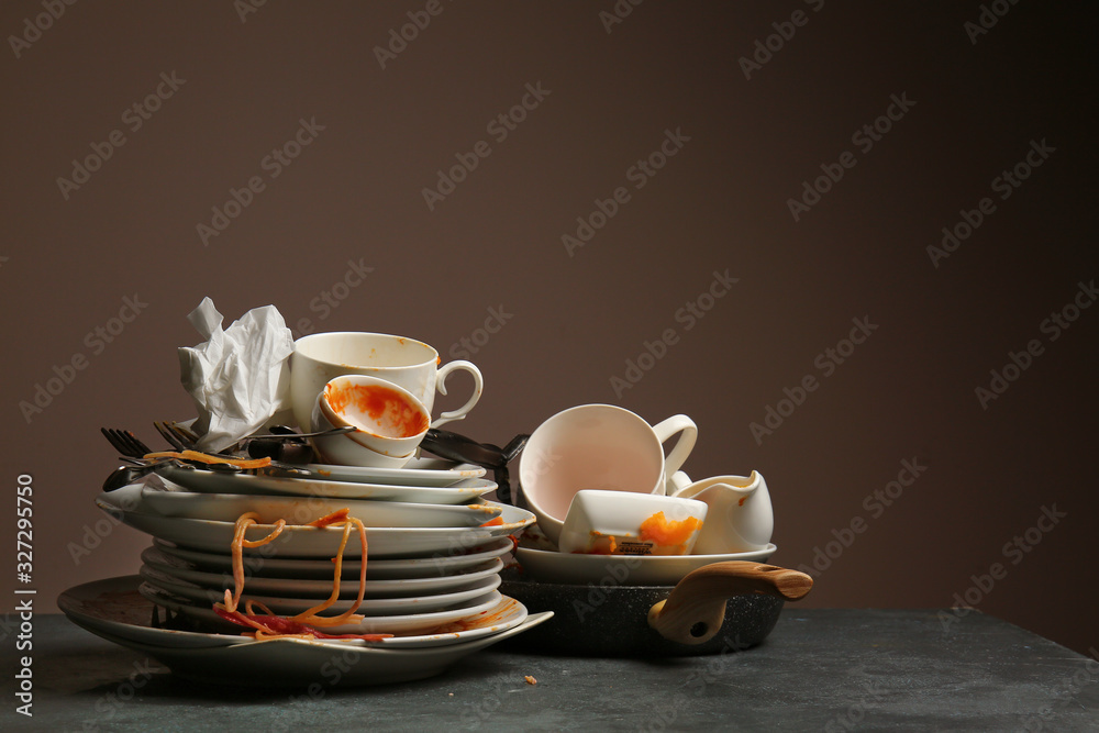 Fototapeta premium Dirty tableware on dark background
