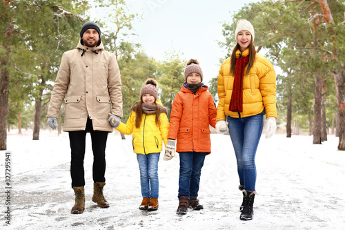 Happy family in park on winter day