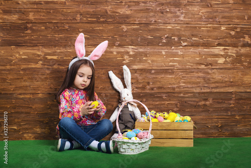 Portrait of a little girl with Bunny ears and Easter eggs  photo