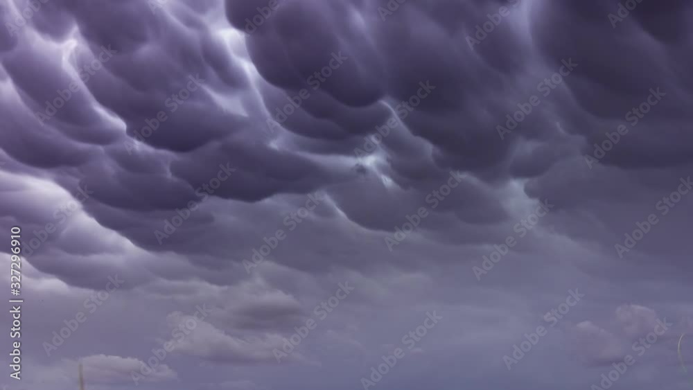 Formation of Mammatus clouds dramatic sky background 4k