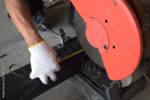  The man used to measure the length and cut the iron causing red sparks.