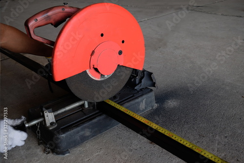  The man used to measure the length and cut the iron causing red sparks.