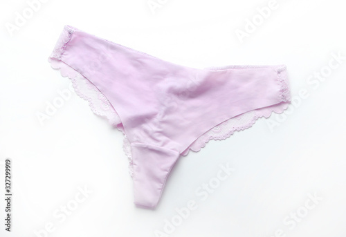 Pink satin panties with lace on white background.Women's underpants on white background.Basic pink lingerie,top view.