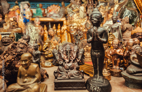 Ganesh statue, Buddha and many others figurines for sale in store of the Amulet Market