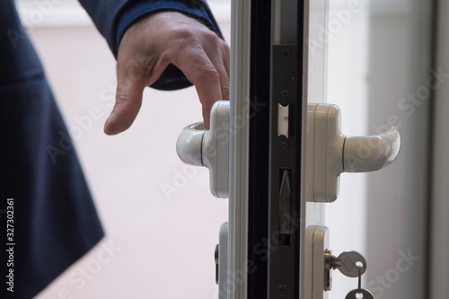 man opening the apartment door, real estate concept