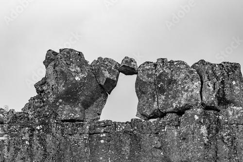 Thingvellir National Park in Iceland rock just stuck between other rocks in black and white photo