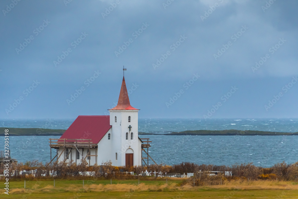 Wooden church in Iceland close to Atlantic coast during stormy weather Wooden church in Iceland close to Atlantic coast during stormy weather