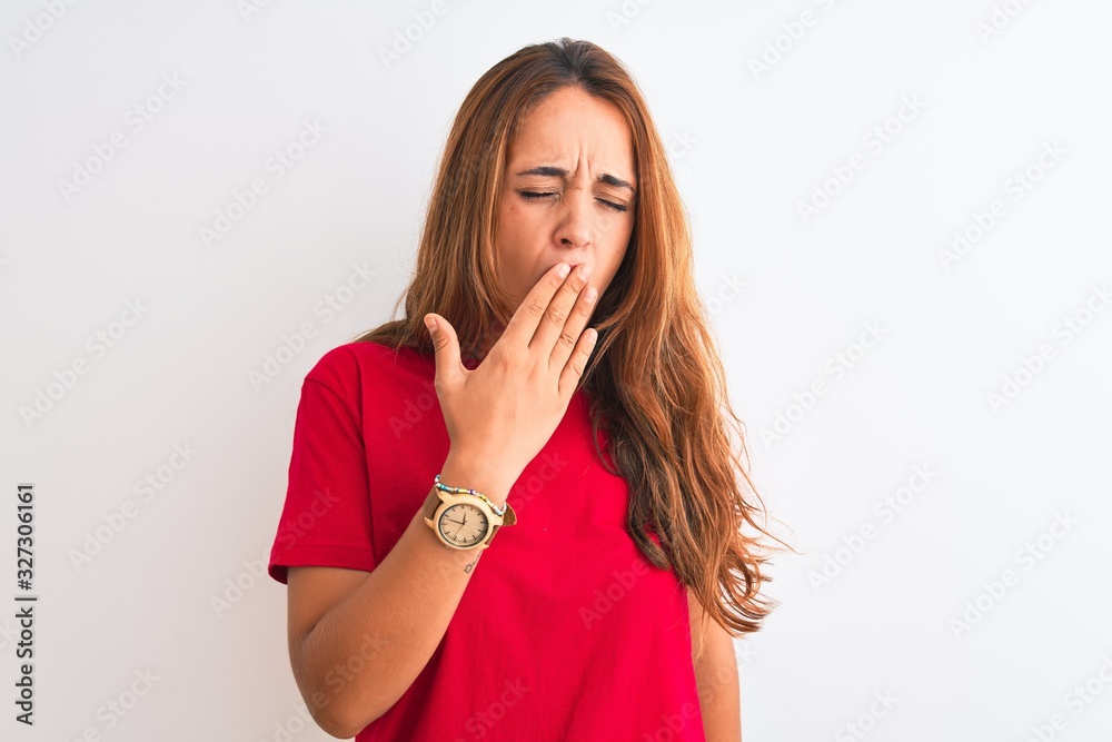 Young redhead woman wearing red casual t-shirt stading over white isolated background bored yawning tired covering mouth with hand. Restless and sleepiness. Young redhead woman wearing red casual t-shirt stading over white isolated background bored yawning tired covering mouth with hand. Restless and sleepiness.