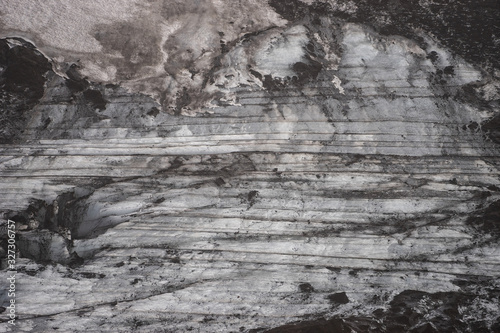 Ice and ashes of the volcano texture landscape, beautiful nature ice background from Iceland.