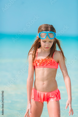 Happy girl enjoy summer vacation on the beach
