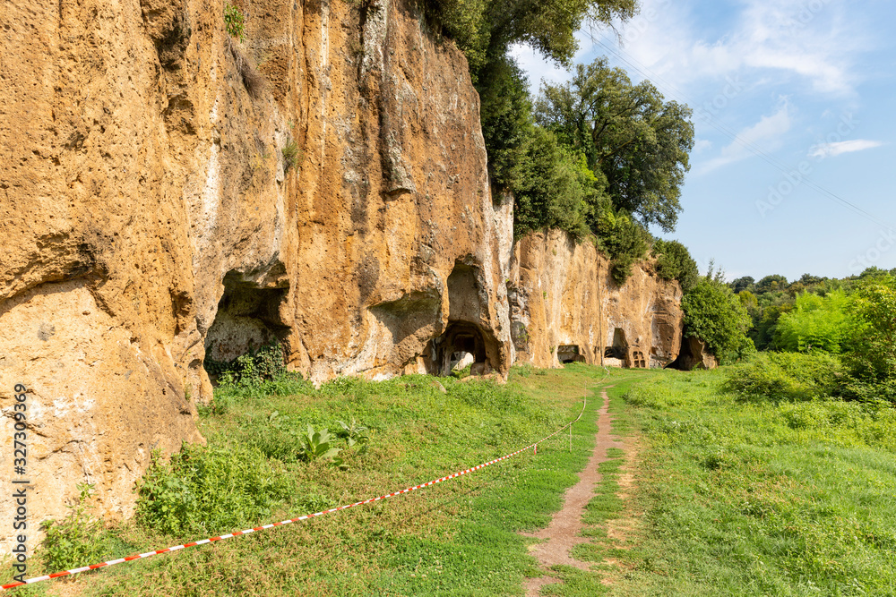 Etruscan necropolis with tombs hollowed out of red tuff rock in Sutri, province of Viterbo, Lazio, Italy