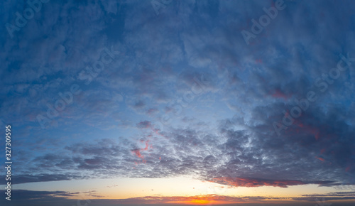 Fantastic dark thunderclouds at sunrise