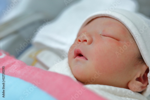 cute little newborn baby sleeping sweet dream in soft blanket