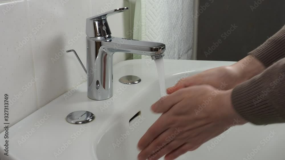 Unrecognisable man washing hands Unrecognisable man washing hands