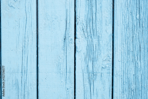 Old painted blue wall textured background, vertical boards