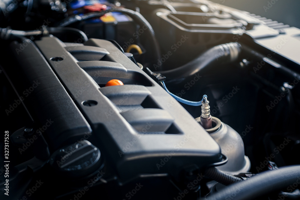 details of modern car engine with sunlight effect, shallow depth of field