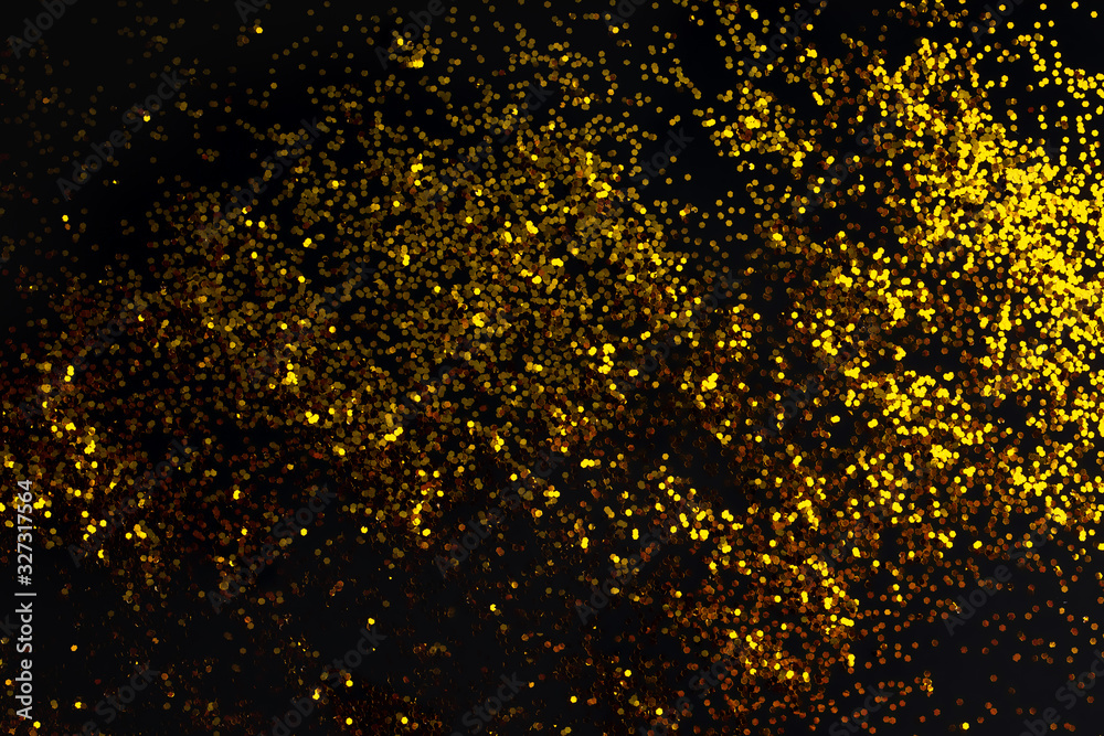 Abstract golden glitter texture on black background Abstract golden glitter texture on black background