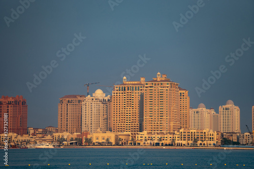 Doha  Qatar  cityscape of modern but still oldschool buildings during sunset