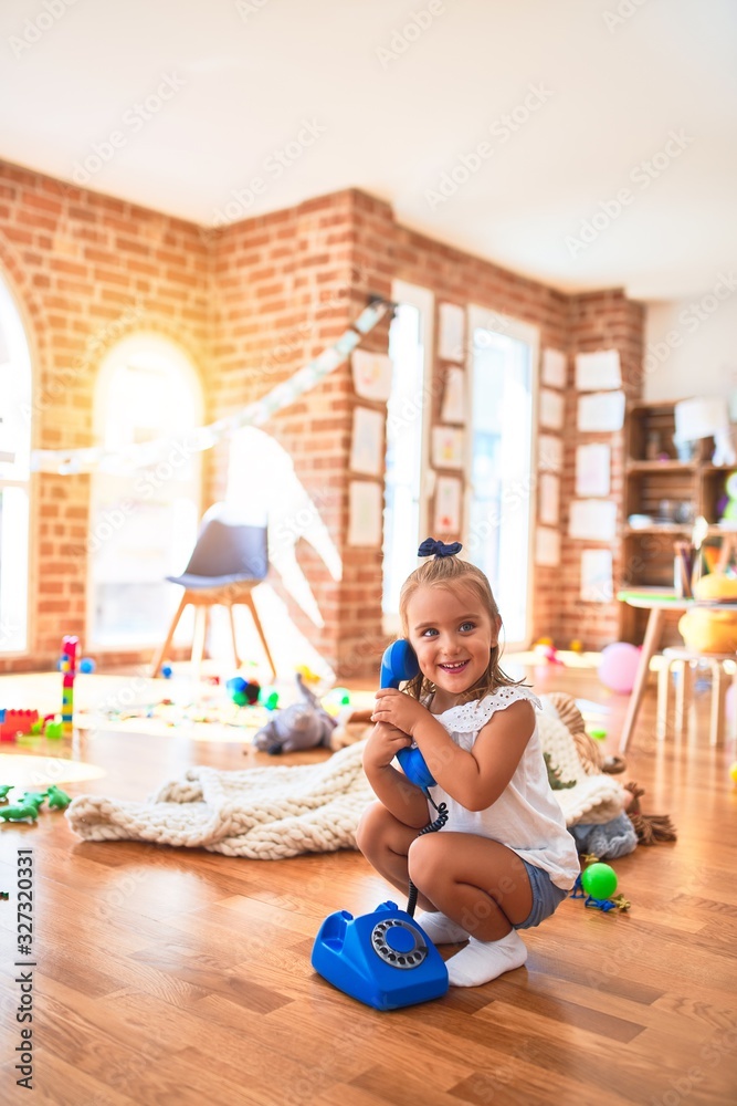 Young beautiful blonde girl kid enjoying play school with toys at kindergarten, smiling happy playing at home Young beautiful blonde girl kid enjoying play school with toys at kindergarten, smiling happy playing at home
