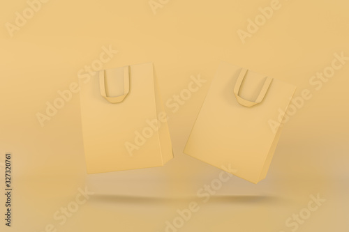 Yellow Shopping bag floating on yellow background.
