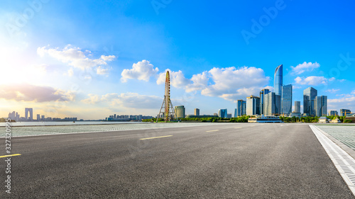 Empty asphalt road and beautiful city skyline with buildings in Suzhou panoramic view.