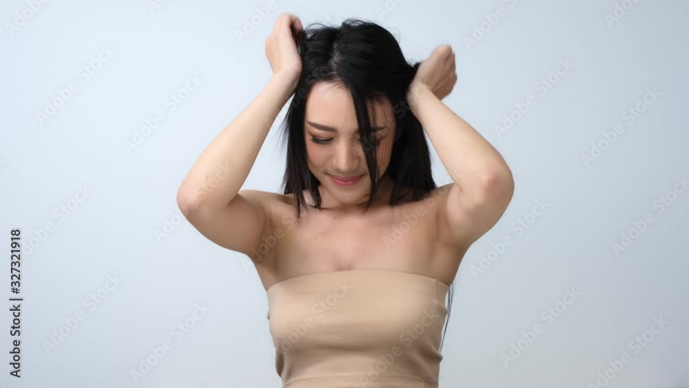 Portrait of beautiful woman with happy emotion at white background. People with beauty, healthy, fashion concept.Attractive Asian woman tossing her long.4k resolution. Portrait of beautiful woman with happy emotion at white background. People with beauty, healthy, fashion concept.Attractive Asian woman tossing her long.4k resolution.