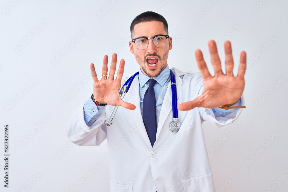 Young doctor man wearing stethoscope over isolated background doing stop gesture with hands palms, angry and frustration expression Young doctor man wearing stethoscope over isolated background doing stop gesture with hands palms, angry and frustration expression