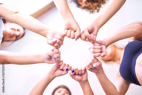 Young beautiful sportwomen doing gesture with hands