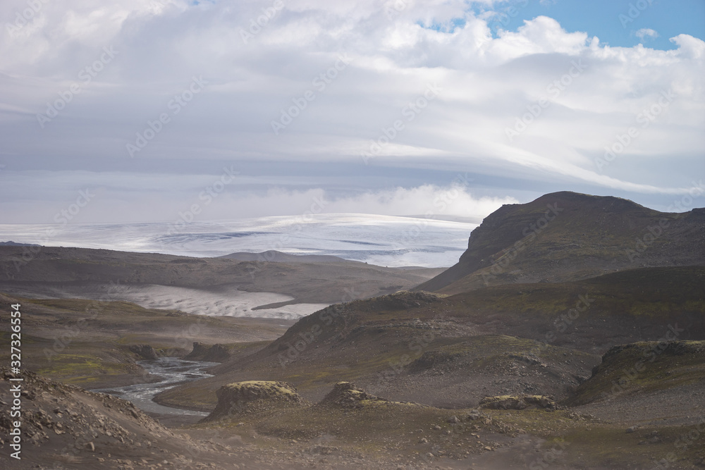 Volcanic landscape with glacier, rocks and ash on the Fimmvorduhals hiking trail. Iceland