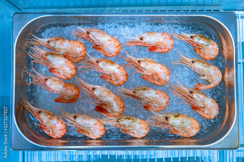 Shrimp lie on the ice. Sale...