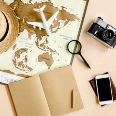 Planning vacation, travel plan, trip vacation using world map along with other travel accessories. Top view, flat lay. Travel, vacation concept.
