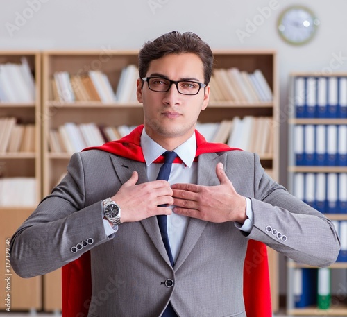 Superhero businessman working in the office