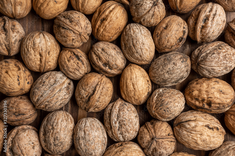 walnut is sprinkled on the table. background. texture. place for text walnut is sprinkled on the table. background. texture. place for text