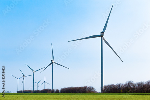 Windmill working at pure wind blowing power of nature photo