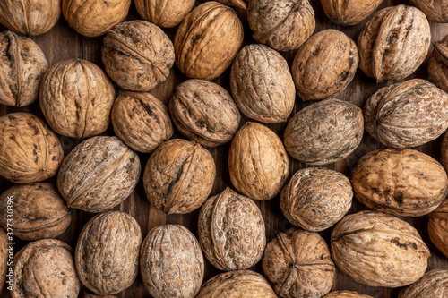 walnut is sprinkled on the table. background. texture. place for text