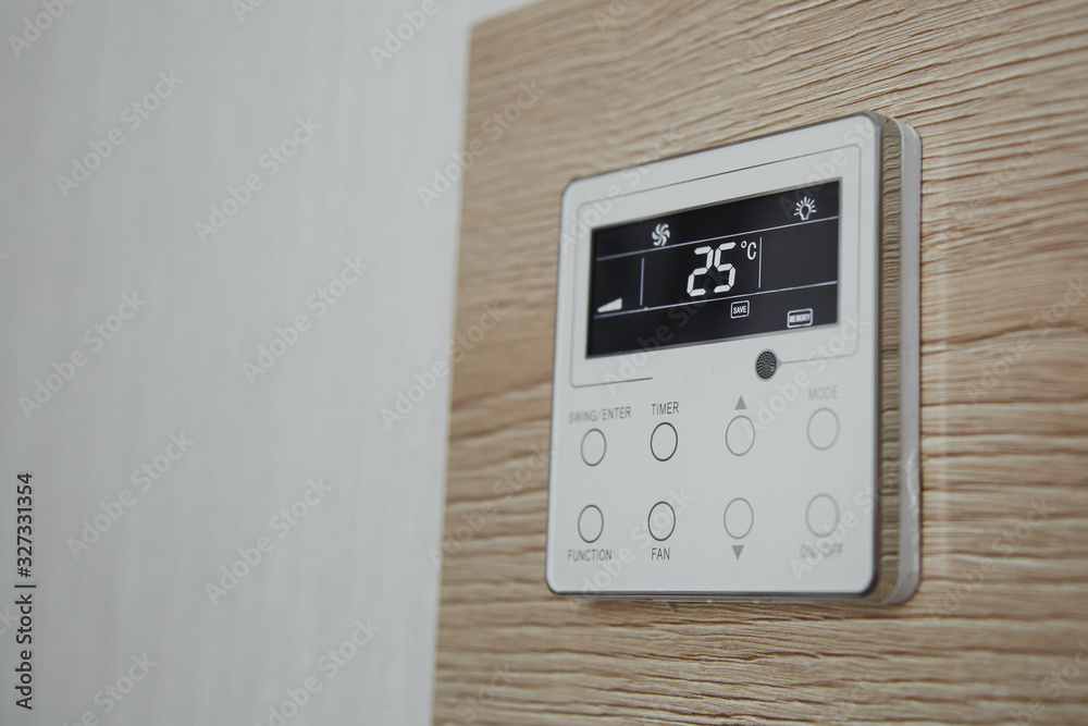 air conditioner screen on the wall that shows an air temperature of 25 degrees Celsius air conditioner screen on the wall that shows an air temperature of 25 degrees Celsius