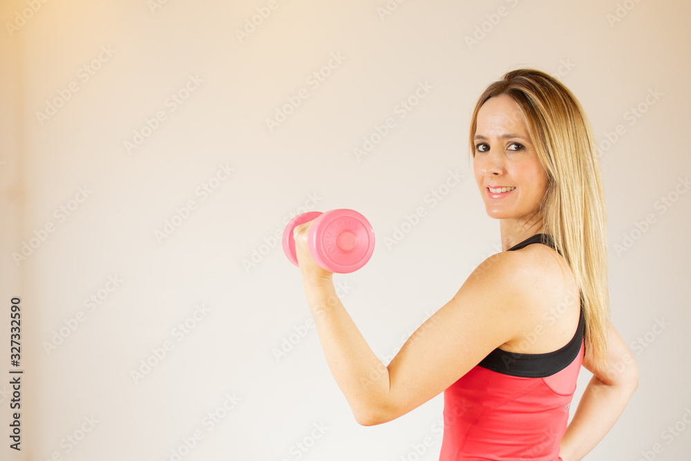 Smiling young woman at the gym Smiling young woman at the gym