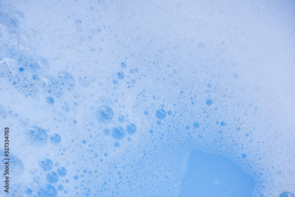 Fototapeta premium Abstract background white soapy foam texture. Shampoo foam with bubbles