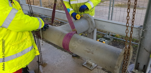 riggers move the pipe with two chain blocks and attach the flange with bolts