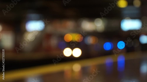 Defocused view of a metro slowing down
