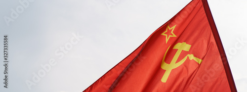 Image of the red USSR flag with hammer and sickle. Celebration of the Victory Day (May 9)  in the Victory Park (Park Pobedy) on Poklonnaya Hill in Moscow. 