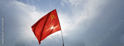 Image of the red USSR flag with hammer and sickle. Celebration of the Victory Day (May 9)  in the Victory Park (Park Pobedy) on Poklonnaya Hill in Moscow. 