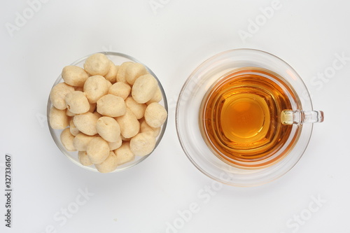 Ampalang snack fish ball a favourite Sabah Borneo food with cup of transparent licker tea  photo