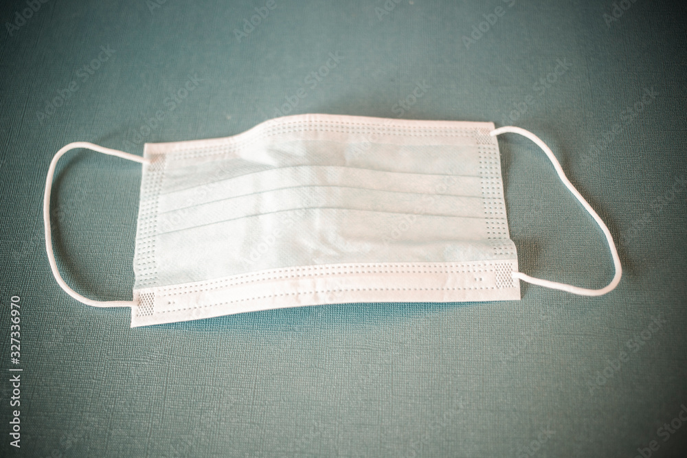 coronavirus world alert surgical mask on blue coronavirus world alert surgical mask on blue