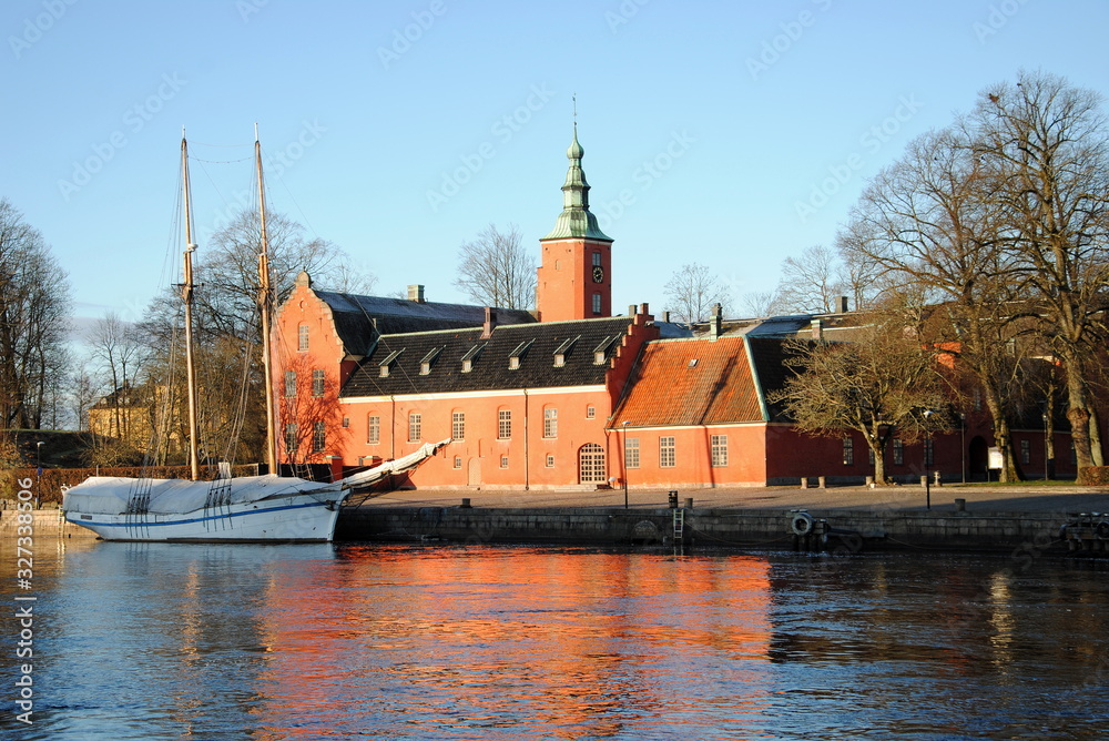 Halmstad Castle (Halmstads slott), a 17th-century castle on the Nissan river in Halmstad, in the province of Halland, Sweden with a two-master moored in front