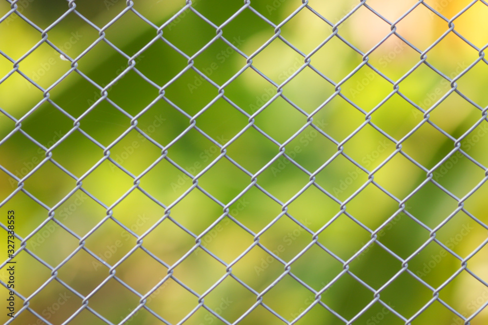 Steel fence wall with green nature background