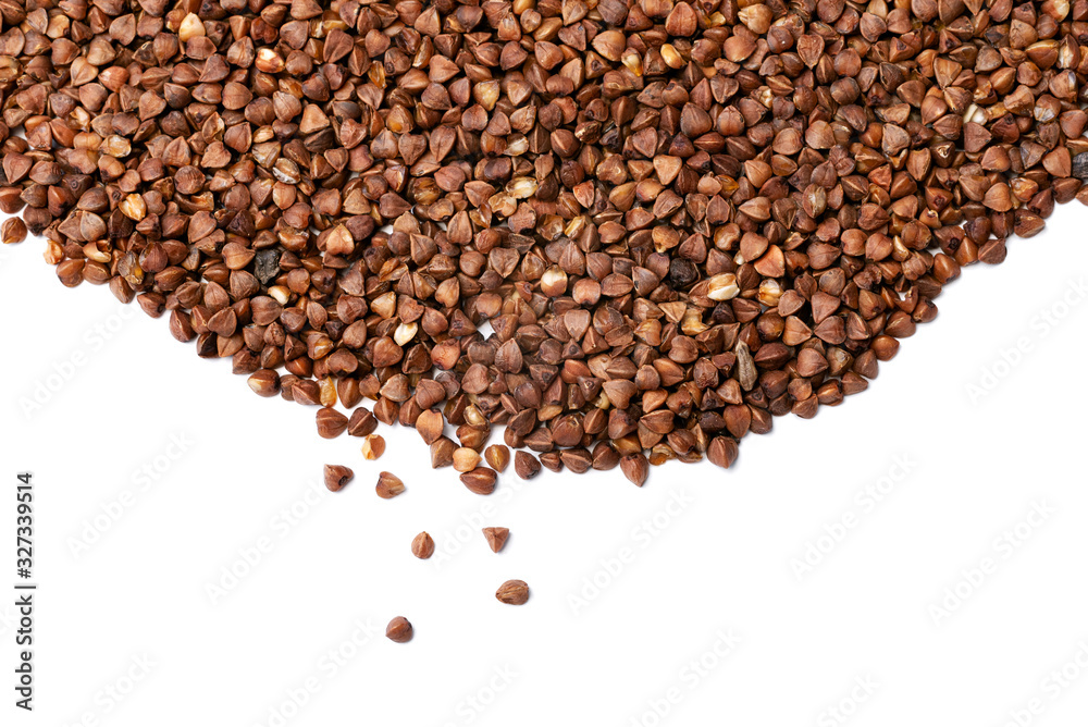 raw buckwheat groats on a white background raw buckwheat groats on a white background