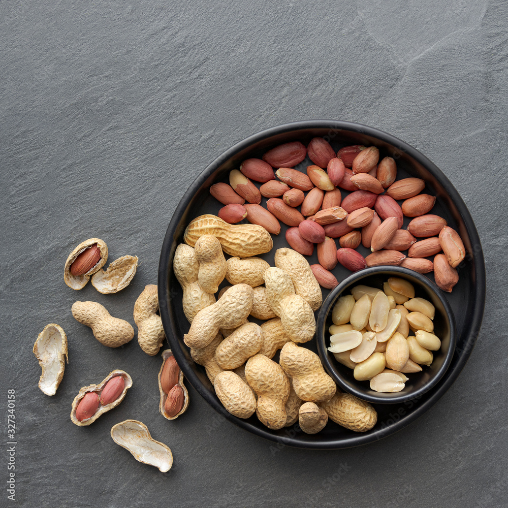 flat lay of peanuts in the shell, peanuts in skin and shelled peanuts
